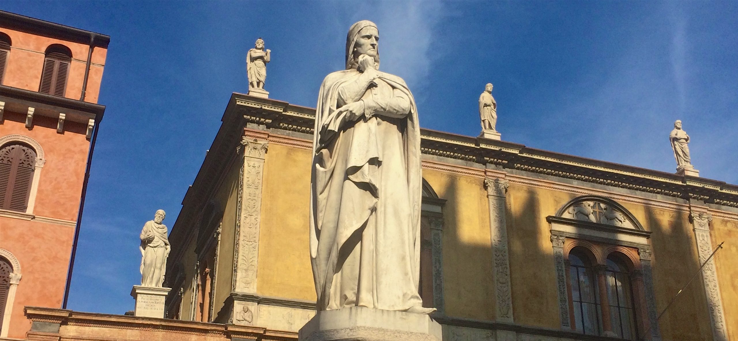 Why, if you go to Verona, will you find Dante looking at you so badly?